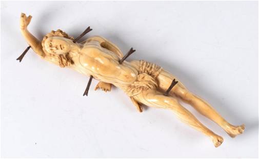 A 17th Century Carving of St. Sebastian: German, 17th century. A figural carving of St. Sebastian, depicting the Miracle of St. Sebastian tied to a tree or post and shot with arrows during the Diocletianic Persecution of Christians; ht. 8, w