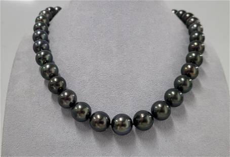 Certified Round Tahitian Pearls - 10.6x12.3mm - Necklace: Title: Certified Round Tahitian Pearls - 10.6x12.3mm - Necklace Description: This necklace is in the category of the Tahitian Pearls according to the tested results and the P.S.L criteria. Emerging fr